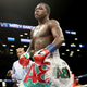 Adrien Broner walks back to his corner after the third round against Mikey Garcia during their Junior Welterwight bout on July 29, 2017 at the Barclays Center in the Brooklyn borough of New York City.